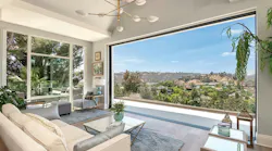 Kolbe® multi-slide doors cleanly pocket into the walls, fully opening the home to outdoor vistas and canyon breezes.|Photo © Adrian Van Anz