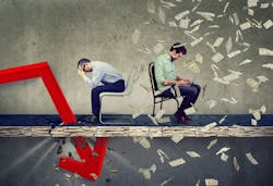 Cash flow management with two men sitting at desks Cash flow management with two men sitting at desks