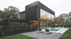 Modern style custom home using black stained cedar