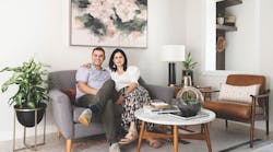 Duoma Atelier's husband and wife team sit on a couch, facing the camera Duoma Atelier's husband and wife team sit on a couch, facing the camera