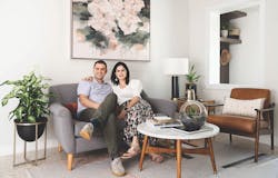 Duoma Atelier's husband and wife team sit on a couch, facing the camera Duoma Atelier's husband and wife team sit on a couch, facing the camera