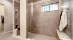 Curbless shower, no door, bench seats at each end Curbless shower, no door, bench seats at each end