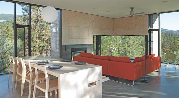 Custom notched kitchen island with high chairs and bench