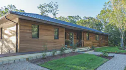 Poplar wood cladding on exterior of Cape Cod high-performance house