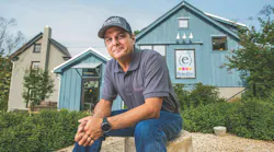 CEO Peter Rotelle sitting in front of his business office