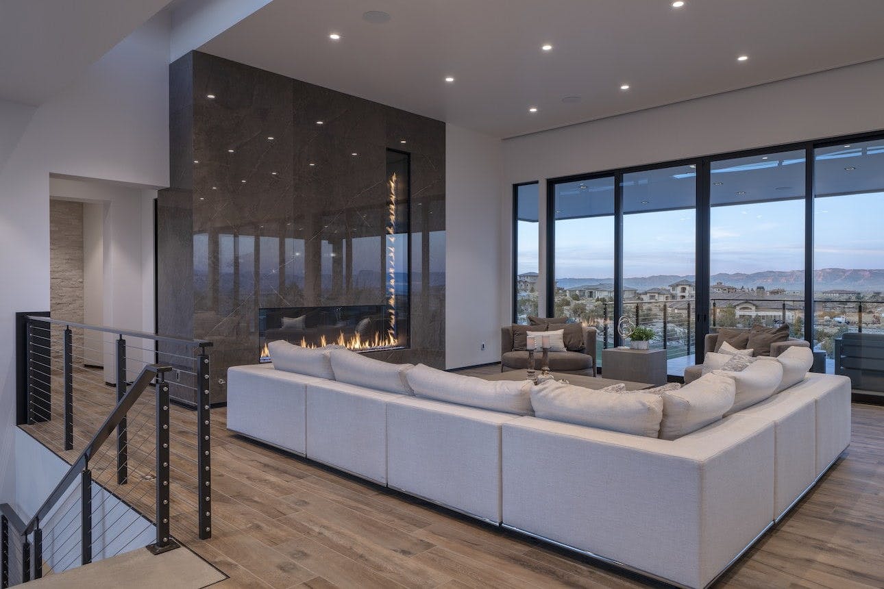 Hillside Paradise L-shaped fireplace in great room