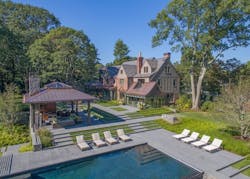 Drone_view_of_Tudor_mansion_with_pool_house Drone_view_of_Tudor_mansion_with_pool_house