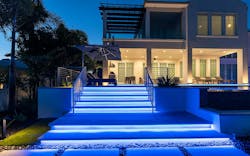 Lighted stairs leading to the outdoor living space of luxury contemporary home Lighted stairs leading to the outdoor living space of luxury contemporary home