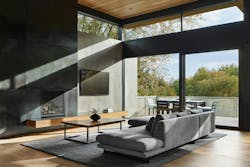 The newly-revamped great room gives the impression of entire walls of glass by combining lift-and-slide doors with clerestory windows The newly-revamped great room gives the impression of entire walls of glass by combining lift-and-slide doors with clerestory windows