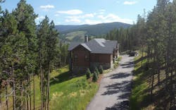 Side view of a cabin in a remote mountain location Side view of a cabin in a remote mountain location