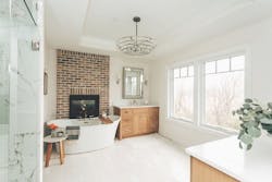 Alma Homes bathroom with free standing tub and fireplace Alma Homes bathroom with free standing tub and fireplace