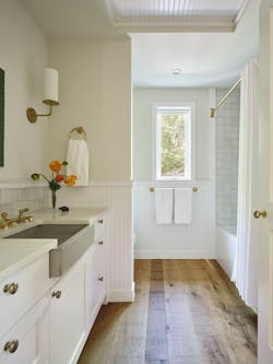 Narrow casement windows in the bedroom and bath frame specific views of nearby live oaks while screening the main house. Narrow casement windows in the bedroom and bath frame specific views of nearby live oaks while screening the main house.