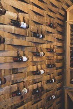 Wine_bottles_held_by_leather_straps Wine_bottles_held_by_leather_straps