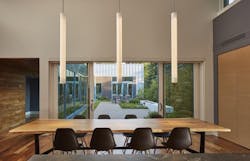 60-foot-long hall, called the “cloister,” with nine Marvin direct-set floor-to-ceiling windows 60-foot-long hall, called the “cloister,” with nine Marvin direct-set floor-to-ceiling windows