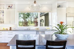 Custom home kitchen with large window view Custom home kitchen with large window view