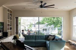 Prefab custom home with accordion glass door divides balcony from interior Prefab custom home with accordion glass door divides balcony from interior