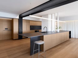 Modern kitchen with walnut built-in cabinetry and black steel running through Modern kitchen with walnut built-in cabinetry and black steel running through