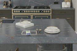 phone charging on a kitchen countertop with glowing circle phone charging on a kitchen countertop with glowing circle