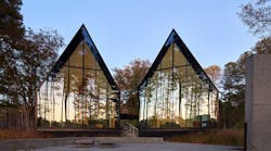 Steeplechase House with steep gabled roof forms and reflective glass panels Steeplechase House with steep gabled roof forms and reflective glass panels
