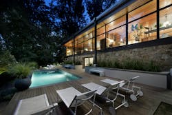 Wood deck around pool on a sloping site Wood deck around pool on a sloping site