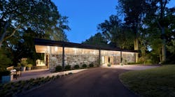 House with clerestory windows at nighttime lit up House with clerestory windows at nighttime lit up