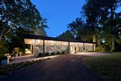 House with clerestory windows at nighttime lit up House with clerestory windows at nighttime lit up