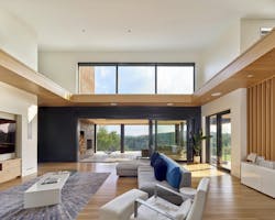 Montem Villam living room with large glass door Montem Villam living room with large glass door