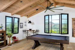 A game room features windows that can both tilt open from the top and swing open at the side. A game room features windows that can both tilt open from the top and swing open at the side.