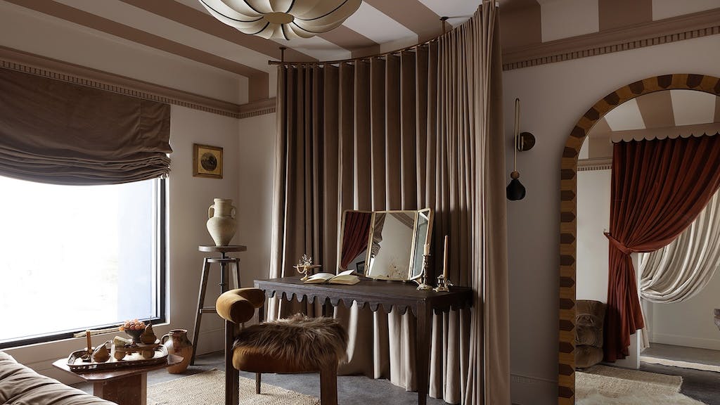 Moody, neutral bedroom with vanity area