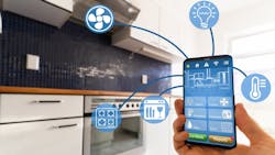 A luxury homeowner uses smart kitchen features on their phone A luxury homeowner uses smart kitchen features on their phone