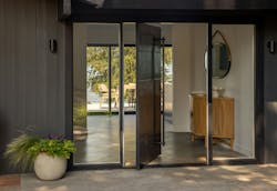 A custom pivot entry door in a Mercer Island renovation | Dyna Builders A custom pivot entry door in a Mercer Island renovation | Dyna Builders