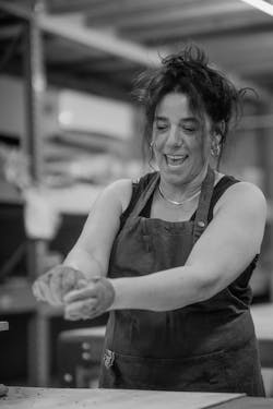 Photo of Concretti Designs founder Yifat Arbely working with concrete Photo of Concretti Designs founder Yifat Arbely working with concrete