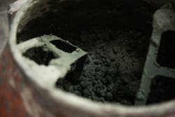 Image of a pigmented green mix of Concretti's proprietary blend of cement, sand, and aggregate Image of a pigmented green mix of Concretti's proprietary blend of cement, sand, and aggregate