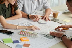 Custom home client concierge reviews design plans with clients Custom home client concierge reviews design plans with clients