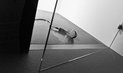 A closeup of a black shower floor with a barrier-free linear drain | Universal Design A closeup of a black shower floor with a barrier-free linear drain | Universal Design