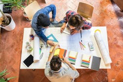 Architect, builder, and client collaborating on selections Architect, builder, and client collaborating on selections