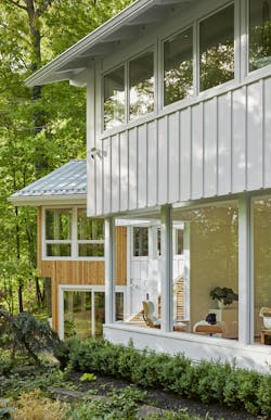 Asphalt shingles were replaced with a standing-seam steel roof, selected for durability, recyclability, and as a budget-conscious alternative to zinc. Asphalt shingles were replaced with a standing-seam steel roof, selected for durability, recyclability, and as a budget-conscious alternative to zinc.