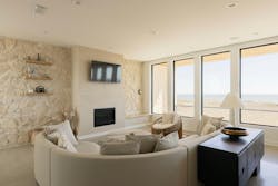 Inside, the home is modern with large windows overlooking the Atlantic Ocean. Inside, the home is modern with large windows overlooking the Atlantic Ocean.
