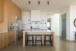 The home's interiors can be described as modern and functional with plenty of kitchen storage and seating to accomodate large groups of people. The home's interiors can be described as modern and functional with plenty of kitchen storage and seating to accomodate large groups of people.