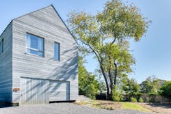 The barn-like facade of architect Wayne Turett's Passive House on Long Island The barn-like facade of architect Wayne Turett's Passive House on Long Island