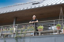 Architect Wayne Turett on the balcony of his Long Island Passive House Architect Wayne Turett on the balcony of his Long Island Passive House