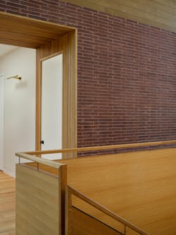 The rainbow netting is balanced by the warm color and material palette found throughout the rest of the staircase. The rainbow netting is balanced by the warm color and material palette found throughout the rest of the staircase.