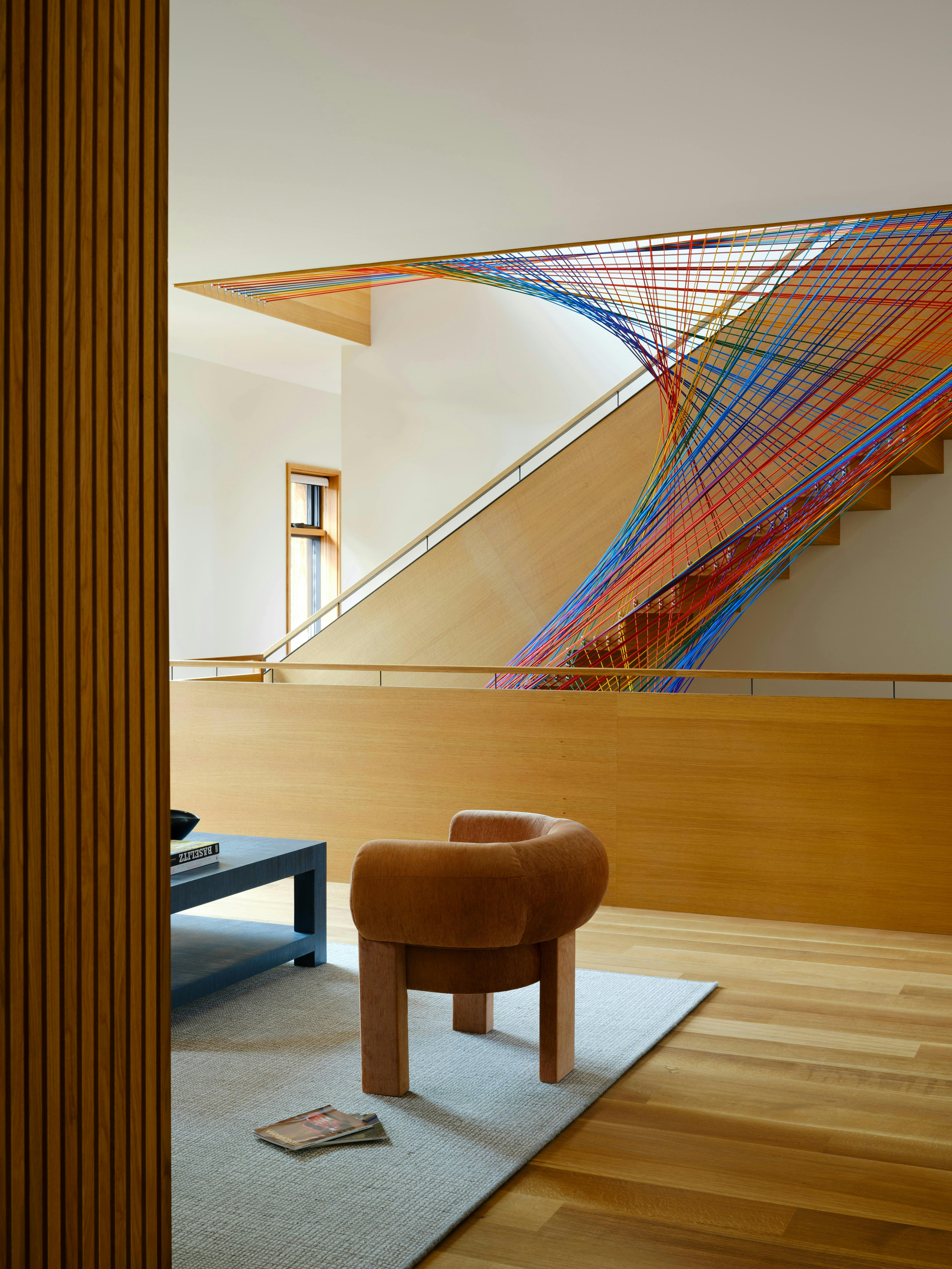 The design team worked with artisan retailer Treenet Collective to create a custom rainbow netting for the space.