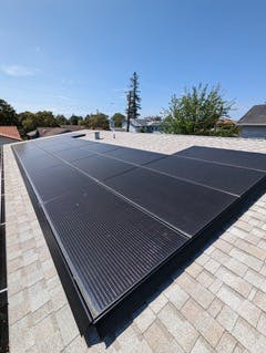 Solar array on a rooftop home by Graham Irwin, Essential Habitat Architecture Solar array on a rooftop home by Graham Irwin, Essential Habitat Architecture