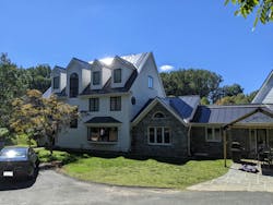 Before photo of the home's exterior Before photo of the home's exterior