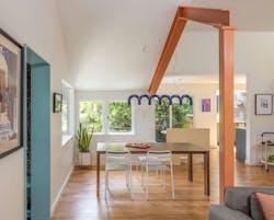 Dining room with exposed industrial beam Dining room with exposed industrial beam