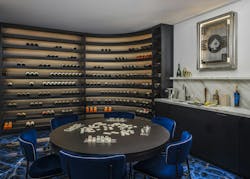 The game table of an underground wine room, with wine storage in the background The game table of an underground wine room, with wine storage in the background