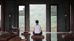 Image of a person doing yoga in a luxury home Image of a person doing yoga in a luxury home
