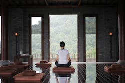 Image of a person doing yoga in a luxury home Image of a person doing yoga in a luxury home