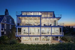 Dusk photo of a luxury waterfront home by Marnie Custom Homes in Delaware Dusk photo of a luxury waterfront home by Marnie Custom Homes in Delaware